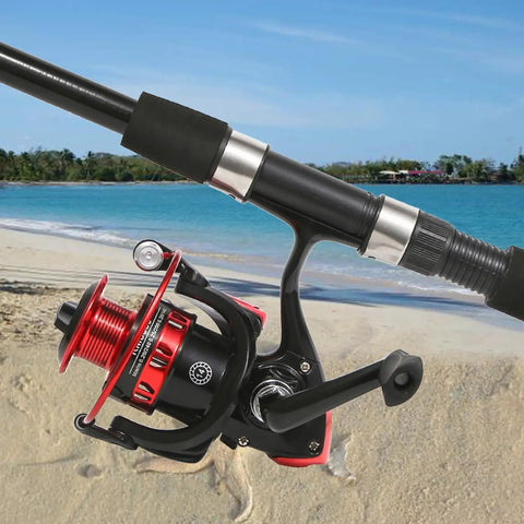 Close-up of a 6.9ft Telescopic Fishing Rod with carbon fiber poles and red reel on a beach, part of a 2 pack combo set.