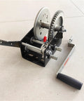 Heavy Duty 2500 Lb Two Way Self Locking Manual Winch Portable Electric Hoist Crane Rigging Gear For Shop Lifting Work Crank Puller showing gears and handle.