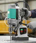 Massive 2-Inch Industrial Magnetic Drill Press With 1450W Motor For Heavy Duty Metal Work in use, drilling into steel.