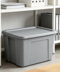 Kickass 30 Gallon Heavy Duty Plastic Storage Bin With Secure Snap Lid For Garage Organization Seasonal Gear Sorting And Everyday Essentials In Matte Gray Finish placed on a shelf.