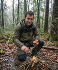 Man using Waterproof Tinder Fire Wax For Wet Wood And Emergency Kits 60g Tin Delivers Up To 50 Lights And Burns For Up To 5 Minutes Per Use