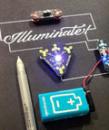 Conductive Ink Pen For DIY Circuits With Silver Ink, non-toxic, writes on paper with illuminated circuits and battery setup.