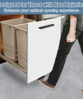 Person using foot pull for trash cabinet drawer with touchless hands free design, full overlay cabinets, modern kitchen convenience