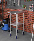 Front view of Besitu 5-inch expanding-stem casters on a stainless steel prep table cart, set of 4 with blue wheels
