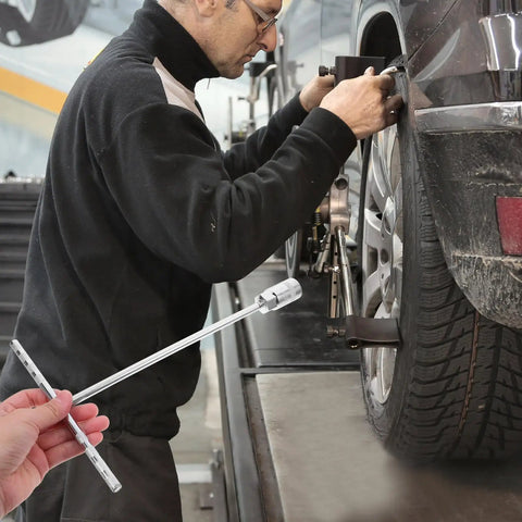 Rock Solid T Handle Socket Wrench Set With Slick Non Slip Grip And Bombproof Steel Build For Smooth Machine Fastener Work And Everyday Garage Swaps For Real Pros used for tire adjustment in an auto shop.