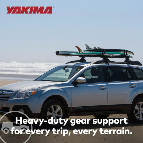 Beefy 60 Inch Aluminum Roof Rack Cross Bars With Integrated Tie Down Points And T Slot Mounts For Rooftop Tents on a silver car at the beach.