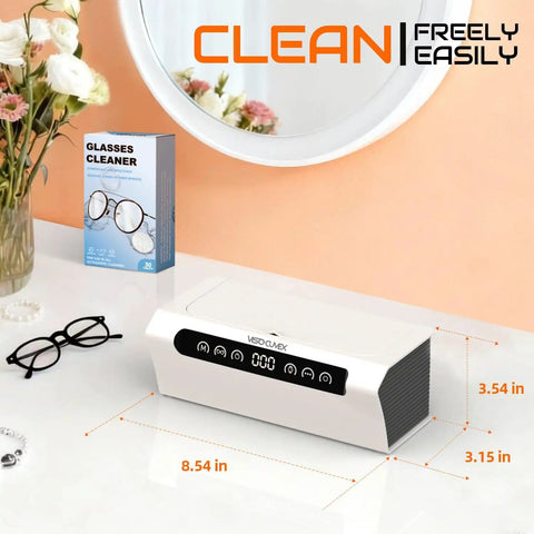 Ultrasonic Jewelry Cleaner 45KHz Machine with 4 Cleaning Modes and Sixteen Point Nine Ounce Capacity on a vanity with glasses cleaner box.