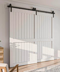 Bypass Sliding Barn Door Hardware Kit, Single Track System, Carbon Steel With Frosted Black Finish, installed on white doors