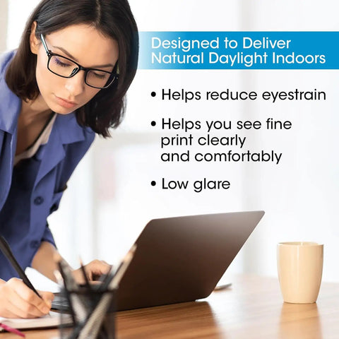 Person using laptop with Dual Shade LED Desk Lamp With Three Color Temperature Modes, Auto Shutoff Timer, Adjustable Neck And Touch Activated Controls in a well-lit room.