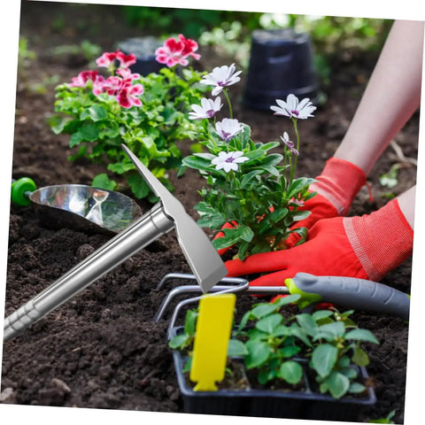 Rustproof Stainless Steel Garden Hoe Handheld Weeding Tool with Ergonomic Grip in use for planting flowers