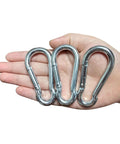 Hardcore Heavy Duty Eye Hooks And Snap Links That Are Legit Tough For Hammocks And Swings With Premium Grade Rust Proof Steel Spring Hooks in hand.