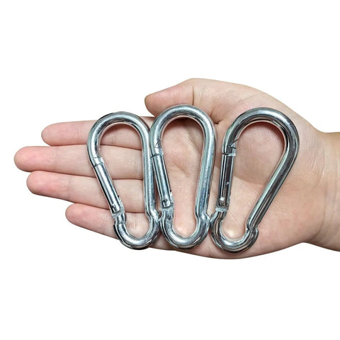 Hardcore Heavy Duty Eye Hooks And Snap Links That Are Legit Tough For Hammocks And Swings With Premium Grade Rust Proof Steel Spring Hooks in hand.