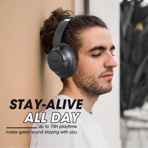 Man wearing upgraded hybrid ANC headphones with transparent modes, 70 hour playtime, Bluetooth headphones with mic, black