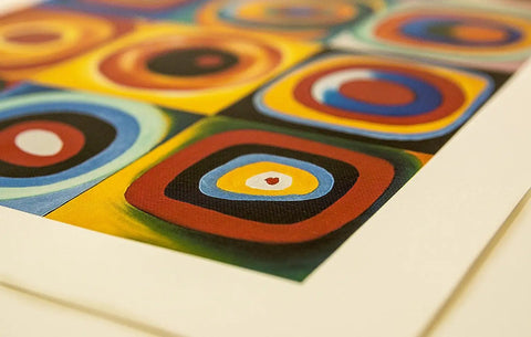 Close-up of colorful abstract circles on a canvas art print, showcasing vibrant concentric designs. Quality canvas texture visible.