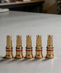 Copper gas diffuser nozzles for MIG welding guns 4335 style, 5 pack, on a workbench