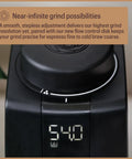 Pro Tier Stepless Grind Adjustment Coffee Grinder Featuring Precision Steel Burrs And Quick Release Design For Smooth Shot Pulling Or Effortless Daily Brewing In Slick Black Finish top view displaying grind adjustment and digital display.