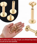 Premium Brass Chicago Binding Screws 4mm X 18mm With 10mm Phillips Nuts 25 Piece in hand; durable fasteners for leather crafts.