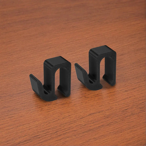Two black multipurpose side hooks for Wonderfold Wagon W4 made of durable plastic on a wooden surface, 2 pack