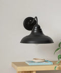 Gooseneck Dusk To Dawn Outdoor Wall Sconces Matte Black Farmhouse Barn Light Two Pack 12 Inch Exterior Wall Light Fixtures For Porch Entryway And Garage, side view on table with plant and books.