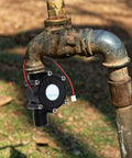Two Pack Portable Mini Hydro Turbine Generator For Water Power DIY Projects attached to outdoor faucet