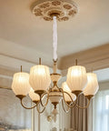 Premium White Fabric Chandelier Cord Covers That Tuck Away Messy Wiring Smoothly trim covering chandelier wiring in elegant setting.