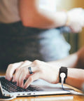 Person using laptop wearing Anti Static Wrist Strap Kit With Grounding Cord For ESD Protection And Static Discharge.