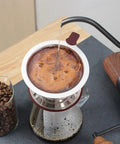 Pouring hot water in Stainless Steel Pour Over Cone Filter With Removable Stand Honeycombed Mesh For Reusable Paperless Brewing
