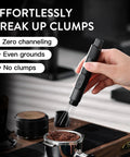 Hand using Retractable WDT Tool For Espresso Distribution And Stirring Magnetic Coffee Distributor Black with needles extended