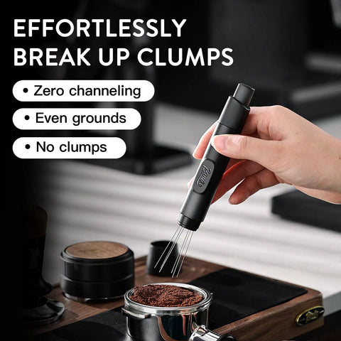 Hand using Retractable WDT Tool For Espresso Distribution And Stirring Magnetic Coffee Distributor Black with needles extended