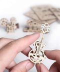 Self Assembly Tribiks Anti Stress Wooden Mechanical Models Kit For Adults And Kids Five And Up Four Miniature Models Desk Toy For Stress Relief Creative Wood Craft Set That Sparks Focus And Fun; beige guitar model in hand
