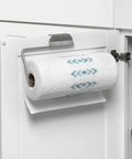 Over The Cabinet Paper Towel Holder in Brushed Nickel installed on white cabinet door with paper towel roll
