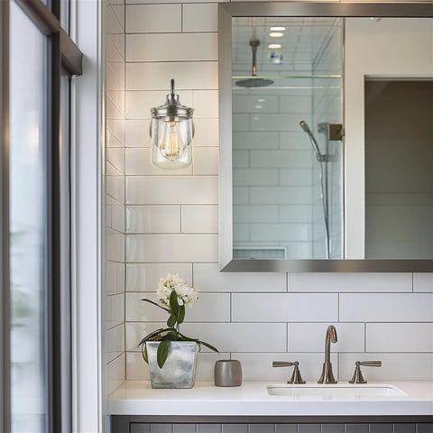 Modern bathroom featuring Mason 10 Inch Modern Farmhouse Wall Sconce With Seeded Glass Jar Shade next to a mirror.