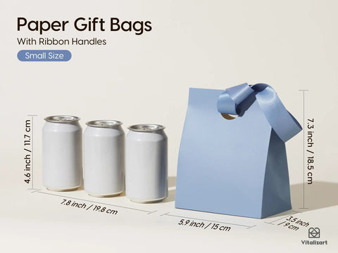 Blue paper gift bag with satin ribbon handle next to cans, showcasing small size 5.9x3.5x7.3 inches, ideal for parties and gifts.