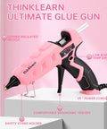 Dual Temp Hot Glue Gun Kit 60W 100W with 15 Glue Sticks shown in pink with copper insulated nozzle and ergonomic design.
