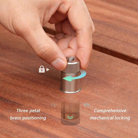 Hand using expansion pins for MFT table holes and locking bench stops, stainless steel, on wooden surface, for precise positioning.