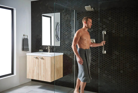 Man using Check Out This Rock Solid Twelve Inch Bathroom Grab Bar in Brushed Nickel Finish on Stainless Steel in modern shower