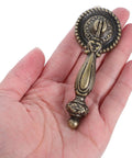 Vintage Zinc Alloy Cabinet Handle Single Hole Round Antique Pull With Bronze Finish in hand showing size and design details.