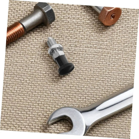 Built Damn Tough Stainless Steel Self Locking Indexing Plunger With Slick Spring Return Knob among screws and a wrench on fabric.