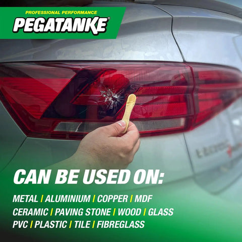 Hand applying Transparent Two Part Epoxy Resin For Quick DIY Repairs And Cold Weld Adhesive on car taillight crack.
