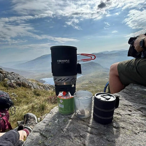 Fixed Star 1 Backpacking Stove System With Propane Cooking Gear on rock ledge during outdoor hike