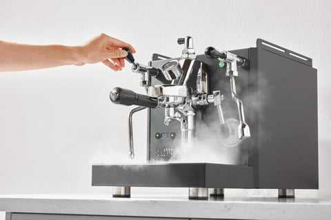 Person using Alto Espresso Machine With Flow Control, Dual Boiler And PID For Precise Temperature, Pro Steam Paddles In Black