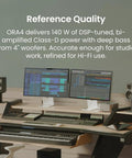 ORA4 Powered Bluetooth Desktop Speakers Pair Matte Black With Rich Stereo Sound in a modern desk setup with monitors