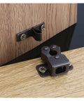 Grab 14 PCS Cabinet Latches For Kitchen Wardrobes! Automatic Spring Catch attached to wooden cabinet door.