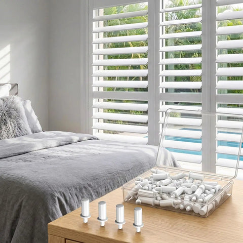 Heavy Duty Spring Loaded Plantation Shutter Pin Repair Kit 50 Pack displayed on a wooden surface with venetian blinds.