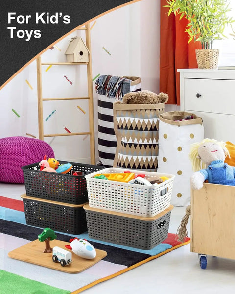 Top Tier Stackable Storage Bins With Bamboo Lids Set Of Six Heavy Duty Bpa Free Plastic Baskets for kids' toys in a playroom.