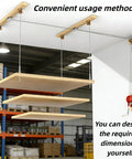 Beefed Up Heavy Duty Ceiling Mounted Garage Storage Lift System With 300 Lb Capacity, wood shelves, metal cables.