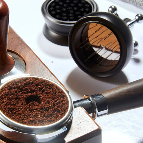 Pro Level 58mm Coffee Powder Distributor And Espresso Stirrer Tool Featuring Adjustable Height Dial Built From Food Grade Metal For Smooth Barista Extraction Plus Even Ground Bedding In Dope Gloss Black with coffee grounds in portafilter.