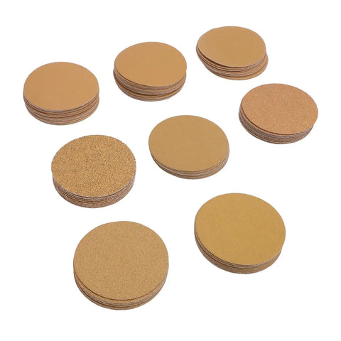 Top Tier 3 Inch Gold Aluminum Oxide Hook And Loop Sanding Discs With Hook Back For Orbital Sanders Smooth Woodwork Auto Body Metal Wall Finishing Pack Of One Hundred Sheets Durable Heavy Duty Abrasive Tool shown in a circular stack.