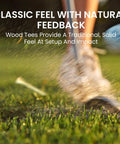 Golfer using Natural Bamboo Golf Tees Wood Two And Three Quarters Inch And Three And One Quarter Inch Bulk Packs on grass