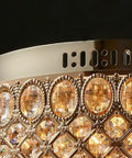 Close-up of Gold Crystal Chandelier Flush Mount Ceiling Light With Diamond Drum Shade luxury design detail and crystal accents.